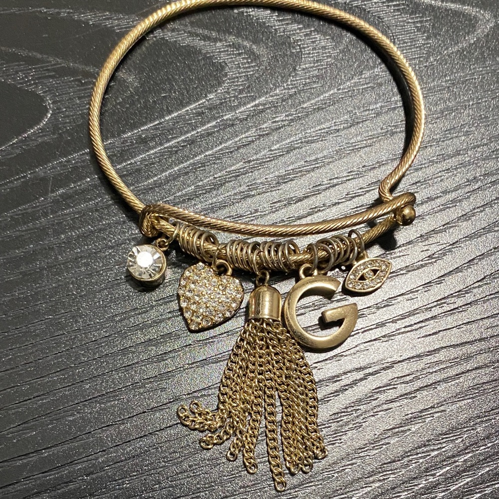Guess Gold Charm Bracelet with Tassel and Heart Accents